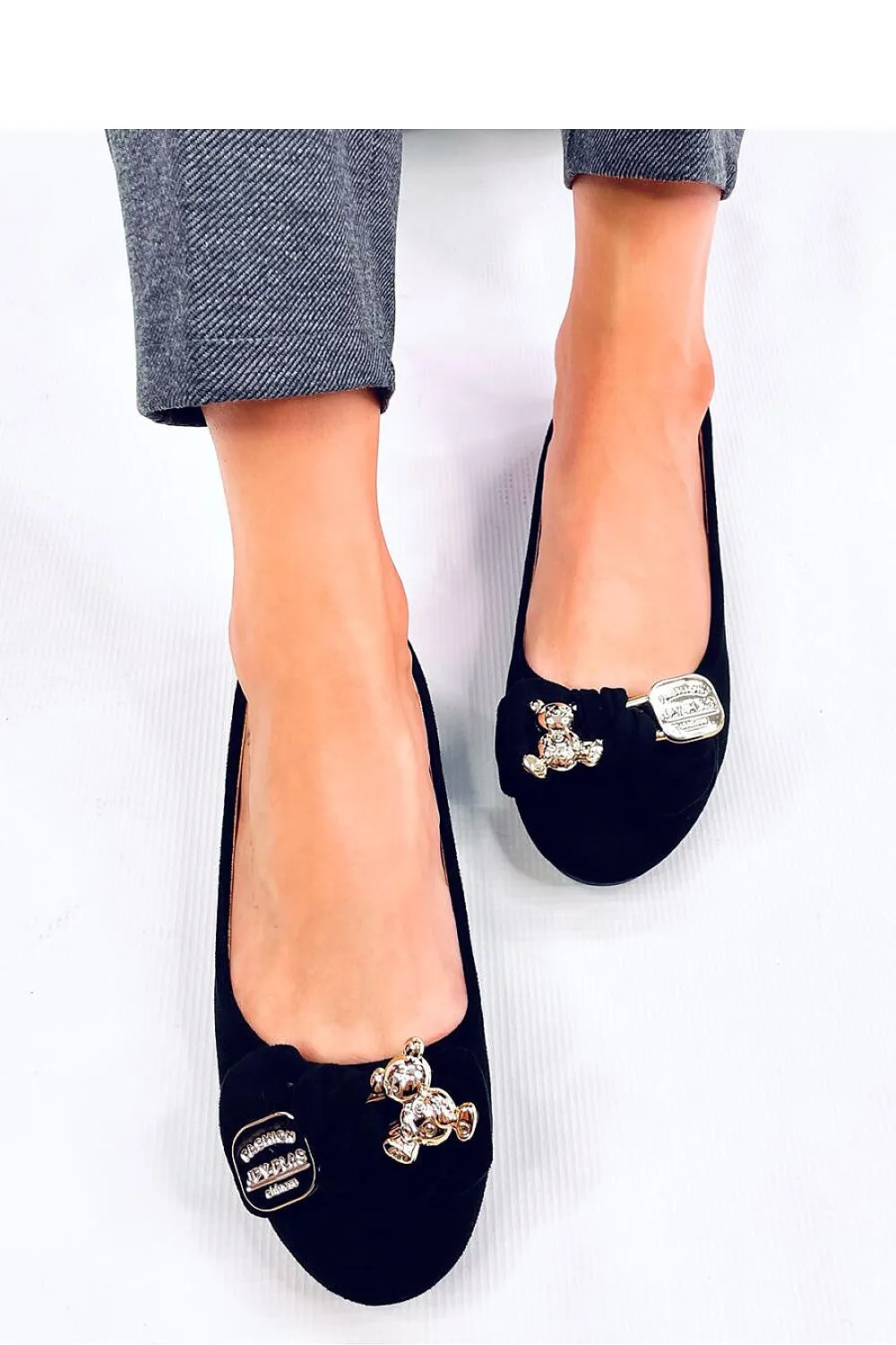 A Bow with a gold safety pin and teddy bear Ballet flats